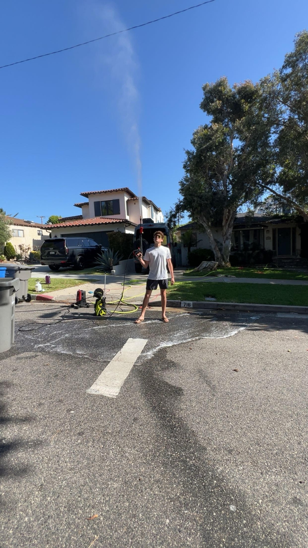 Power washing equipment and operator in a South Bay neighborhood